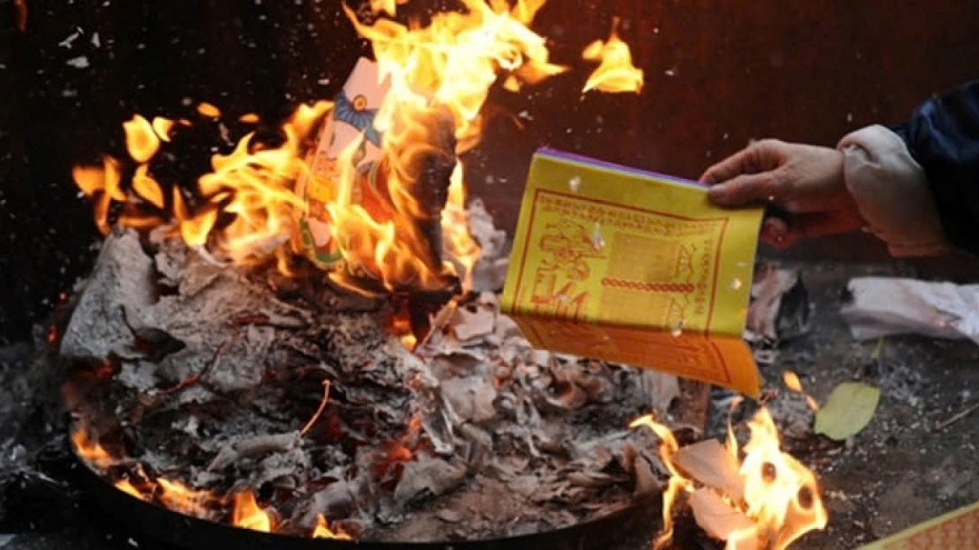 The custom of burning paper offerings during Lunar New Year celebration